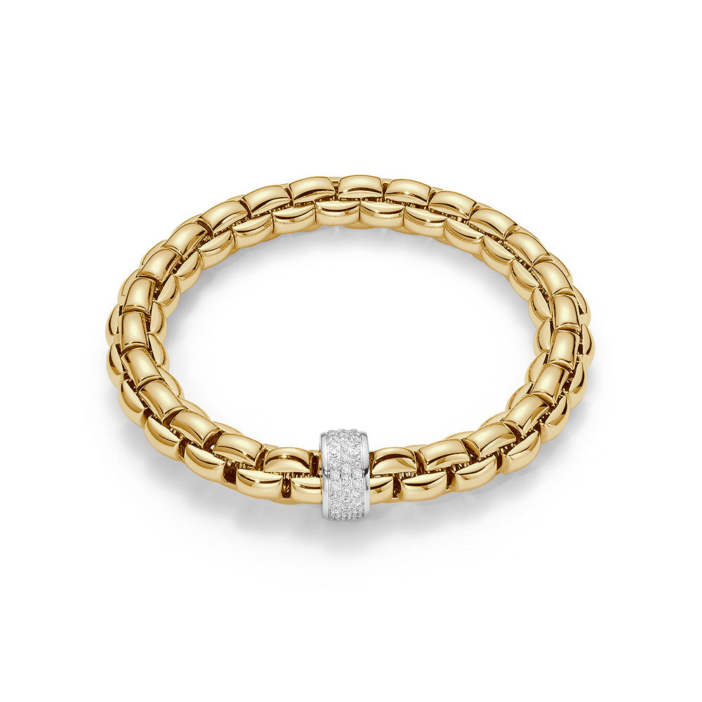 Flexible bracelet entirely made of 18 carat yellow gold with 0.63ct of diamonds pave set in white gold rondel. Each Fope jewel is hand crafted in Vicenza, Italy to the finest Italian standards
